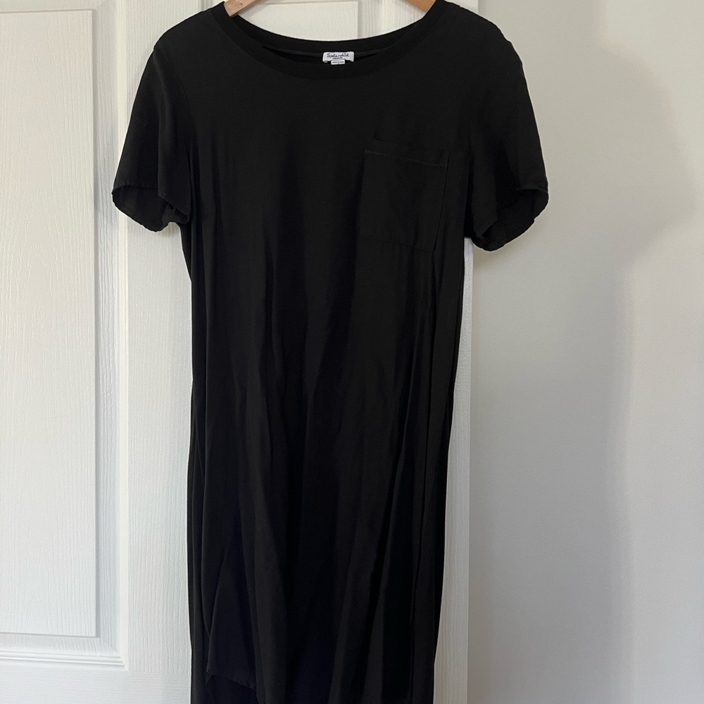 Perfect spring/summer Black T-Shirt Dress with front accent pocket.